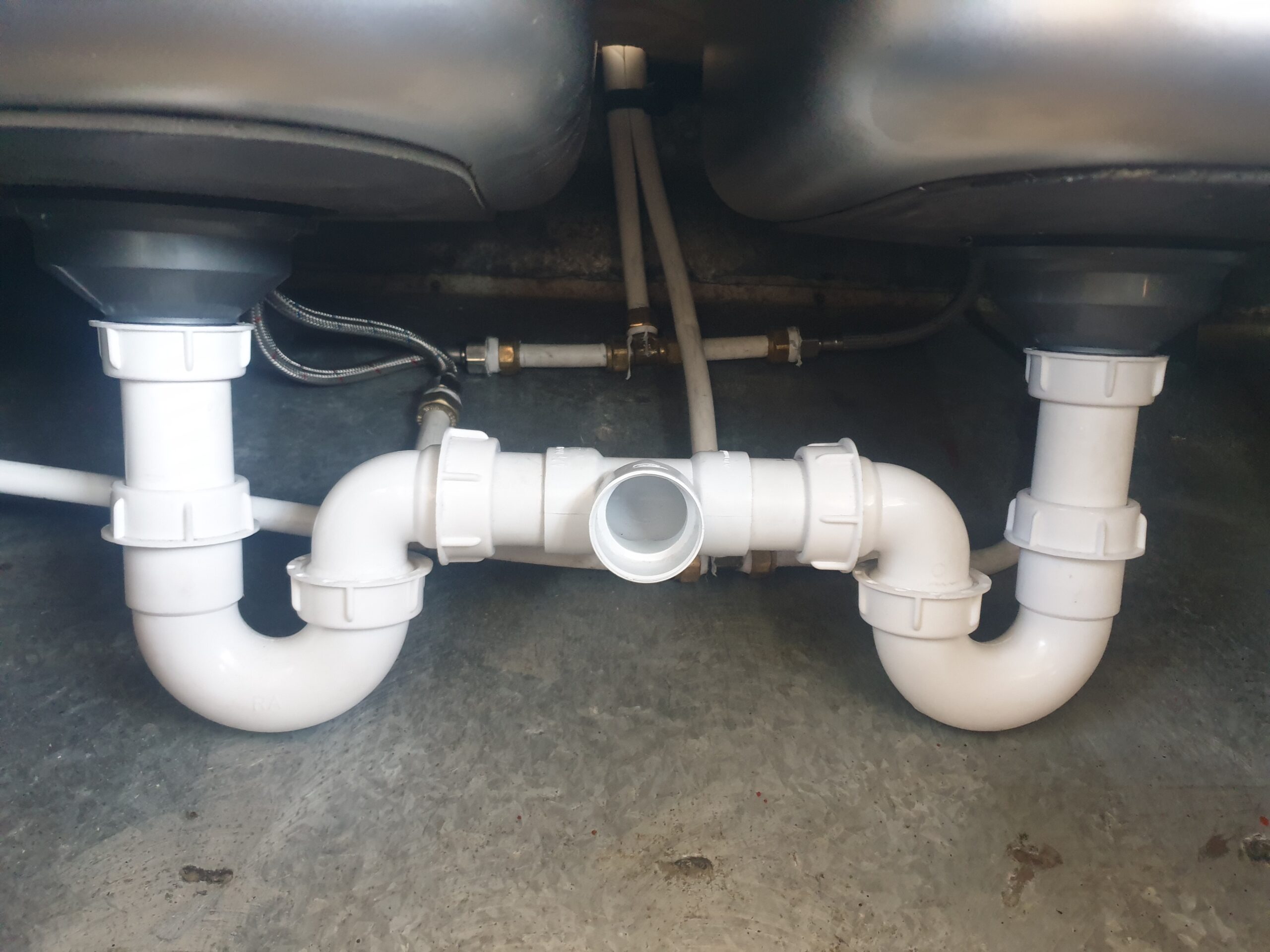 Plumber repairing geyser